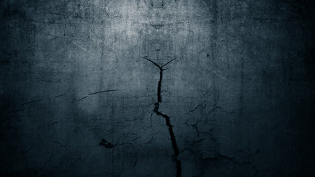 Surface of black concrete wall with cracks and holes. Abstract pattern of concrete wall. Mock up. Copy space. Wall textured backgroundの写真素材