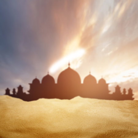 Desert with view of silhouette of a mosque with clouds on sunset scene background. Islamic religion, Ramadan kareem, or Eid Al Fitr backgroundの写真素材