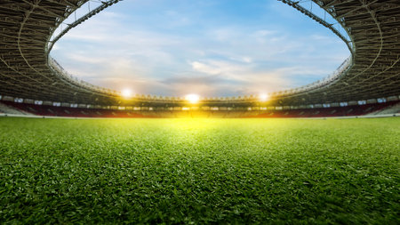 Empty football stadium with green field and spotlights. The field is ready for a game. Concept of Professional sport, Competition, Championship and match. Soccer stadium field backgroundの写真素材