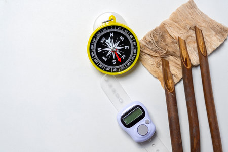 Set of calligraphy reeds with digital prayer beads and qibla compass isolated over white background....