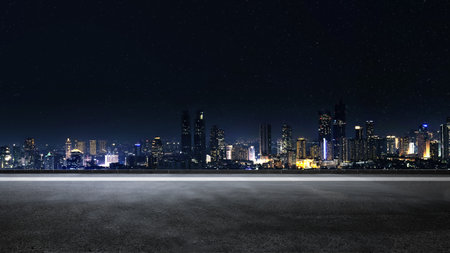 Empty asphalt road with view of modern building skyscrapers and futuristic architecture with night...