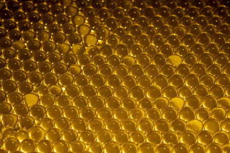 Golden water gel balls. Polymer gel. Silica gel. Balls of hydrogel round shape. Crystal liquid ball...
