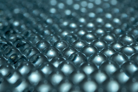 Blue water gel balls. Balls of round shape. Crystal liquid ball with reflection. Water beads....