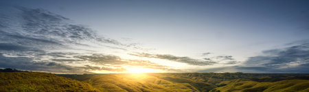 Mountain range and beautiful sunset scene view. Sky clouds with sunlight in the evening. Horizon sky landscape and dusk sky backgroundの写真素材
