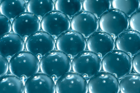 Blue water gel balls. Polymer gel. Silica gel. Balls of hydrogel round shape. Crystal liquid ball...