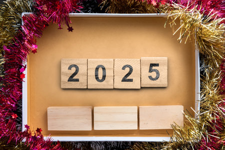 Wooden blocks with 2025 numbers in the gift box. Happy New Year concept or Celebrationの写真素材