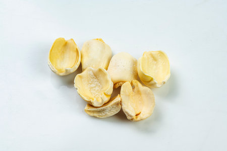 Closeup view of lotus seeds (Nelumbo nucifera) on a white background. Concept of healthy food. Chinese Or Lunar New Year decorationの写真素材