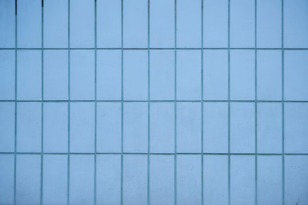 Closeup view of the gray wall. Abstract pattern of a tiled wall. Mockup. Copy space. Wallpaper or...