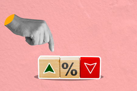 A human hand pointing an arrow up on wooden cubes with a percentage symbol. Concept of interest...