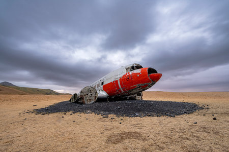Abandoned wrecked airplane of DC3 on Eyvindarholt, Iceland. Nature, travel, winter background, or wallpaperの写真素材
