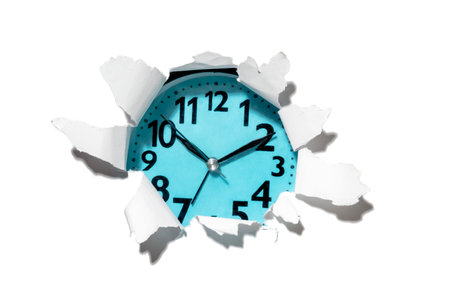 Clock face on ripped paper. Mockup or Copy space. Concept of time management, reminder or planning, deadline, timetable and countdownの写真素材