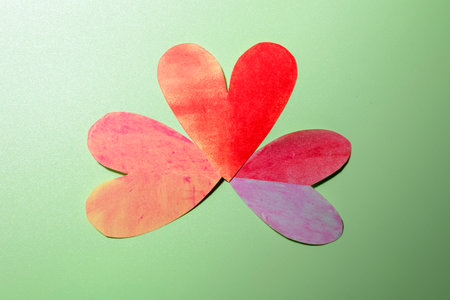 The pile of red hearts on a colored background. Copy space. Mockup. Valentine Card. Decoration for Valentine celebrationの写真素材