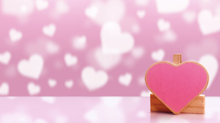Red heart with the blurred shapes of hearts in the background. Copy space. Mockup. Valentine Card. Decoration for Valentine celebrationの写真素材