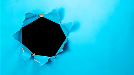 Top view of blue ripped paper with black background. Mockup. Copy space. Presentation or template. Flat layの写真素材