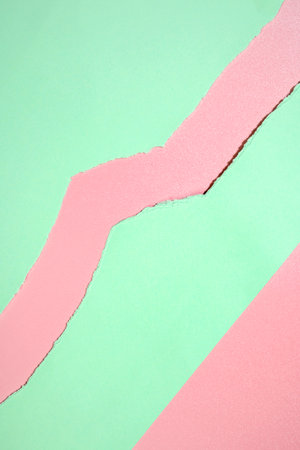 Top view of torn green paper on a colored background. Mockup. Copy space. Presentation or template. Flat layの写真素材