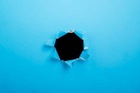 Top view of blue ripped paper with black background. Mockup. Copy space. Presentation or template. Flat layの写真素材