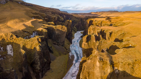 Aerial landscape view of Fjarrgljfur or Fjadrargljufur Canyon with Fjadrar river flow on Iceland. Taken by drone. Nature, travel, background, or wallpaperの写真素材