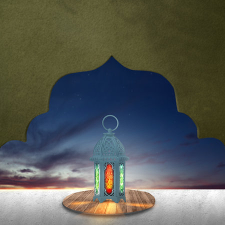 Traditional glowing Arabic lantern on the table with mosque dome pattern and sunset scene...