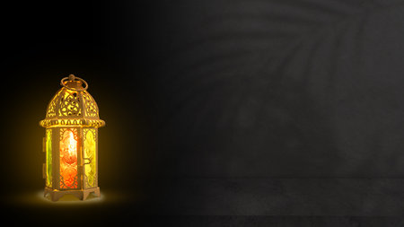 Traditional glowing Arabic lantern on black background. Copy space. Concept of Religion, Spiritual...