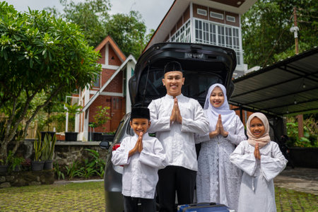 Asian Muslim family ready to mudik or travel to hometown by car. Concept of Eid Al Fitr, Idul Fitri, Lebaran, and Ramadan Mubarak celebrationの写真素材