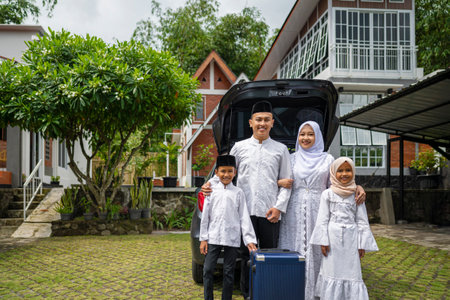 Asian Muslim family ready to mudik or travel to hometown by car. Concept of Eid Al Fitr, Idul Fitri, Lebaran, and Ramadan Mubarak celebrationの写真素材