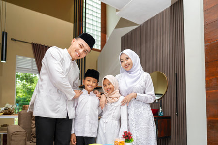 Portrait of the Indonesian Muslim family celebrating Eid Mubarak. Concept of Happy Lebaran, Eid Al Fitr, Idul Fitri, and Ramadan Mubarak celebrationの写真素材
