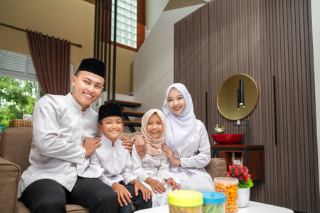 Portrait of the Indonesian Muslim family celebrating Eid Mubarak. Concept of Happy Lebaran, Eid Al Fitr, Idul Fitri, and Ramadan Mubarak celebrationの写真素材