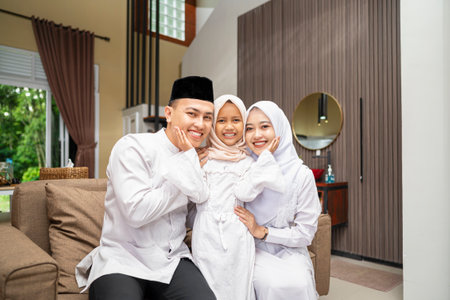 Portrait of the Indonesian Muslim family celebrating Eid Mubarak. Concept of Happy Lebaran, Eid Al...