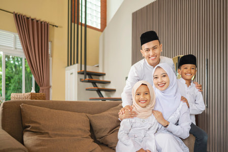 Portrait of the Indonesian Muslim family celebrating Eid Mubarak. Concept of Happy Lebaran, Eid Al Fitr, Idul Fitri, and Ramadan Mubarak celebrationの写真素材