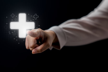 Business hand touching medical icon. Digital healthcare innovation on a virtual screen. Concept of medical tech, telemedicine, and healthcare analyticsの写真素材