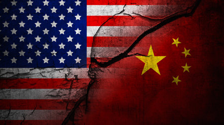 Flags of the USA or the United States of America and China on the cracked wall background. Concept of the United States of America versus China trade war disputes or economic conflictの写真素材