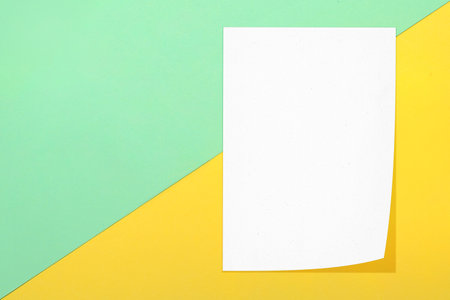 Top view of business letterhead on colored background. Blank paper or sheet. Mockup or copy space for your designの写真素材