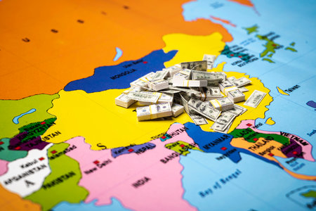 Map of China with a stack of dollars banknotes. Concept of the United States of America versus China trade war disputes or economic conflictの写真素材