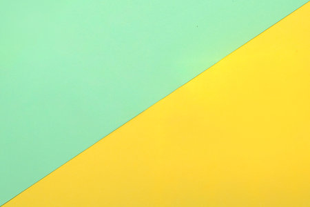 Top view of green and yellow paper. Blank paper or sheet. Mockup or copy space for your designの写真素材