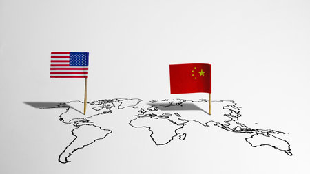 Flags of the USA or the United States of America and China on the maps with a white background. Concept of the United States of America versus China trade war disputes or economic conflictの写真素材