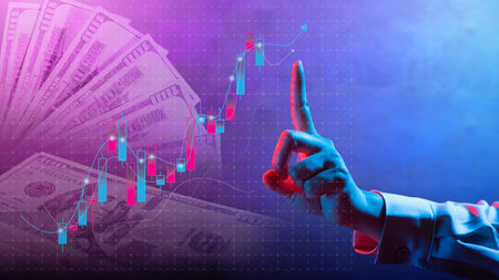 Business hand touching upward graph with candlestick and 100 dollar banknotes in the background. Technology innovation on a virtual screen. Concept of World Economic Growthの写真素材