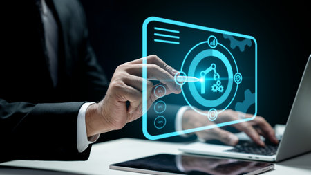 Businessman using a laptop while touching a robotic arm and a gear icon. Tablet on the table. Technology innovation on a virtual screen. Concept of robotic process automationの写真素材