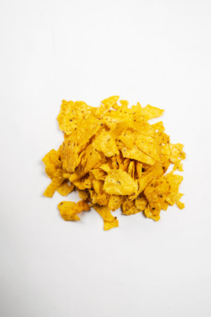 Heap of nachos tortilla chips on a white background. Food and snacks concept