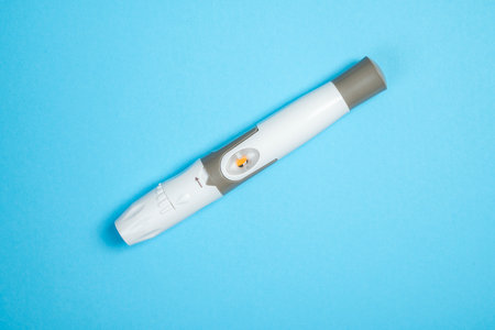 Lancet for checking blood sugar level. Concept of diabetes or a healthy lifestyleの写真素材