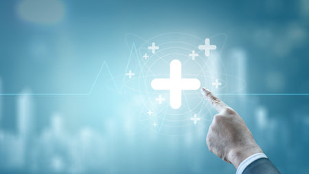 Businessman showing medical health icon. Digital healthcare innovation on a virtual screen. Concept of medical tech, telemedicine, and healthcare analyticsの写真素材