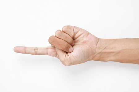 A hand is shown with its index finger pointing upward, isolated on a white background.の写真素材