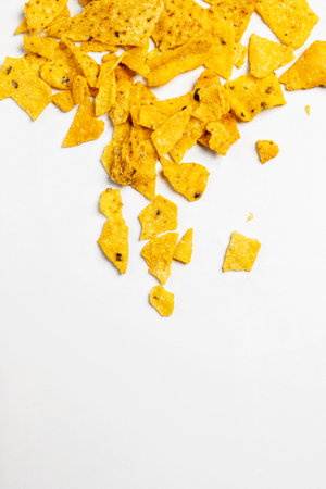 Heap of nachos tortilla chips on a white background. Food and snacks conceptの写真素材