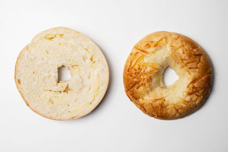 Closeup view of slice of bagel breads isolated over white background. Top and middle part. Top viewの写真素材