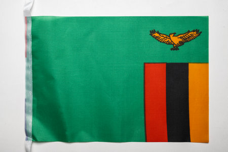 Closeup view of the Zambia national flag isolated over a white background. Concept of government and nationalityの写真素材