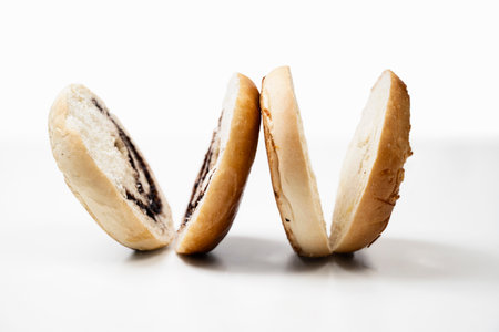 Closeup view of slices of bagel bread isolated over a white backgroundの写真素材