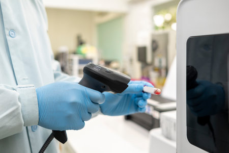 Scientist checking quality of medicine in the modern inspection laboratory in a medicine production factoryの写真素材