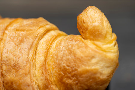 Closeup view of croissant on the table. Breakfast snack