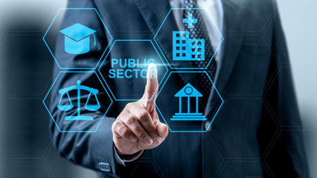 Businessman touching public sector icon. Technology innovation on a virtual screen. Concept of public sector governanceの写真素材