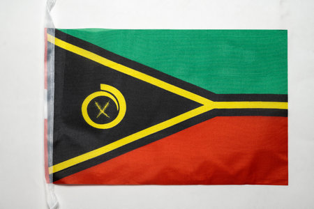 Closeup view of the Vanuatu national flag isolated over a white background. Concept of government and nationalityの写真素材