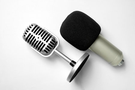 Studio and vintage silver microphone for podcasting or streaming with a white background. Top viewの写真素材